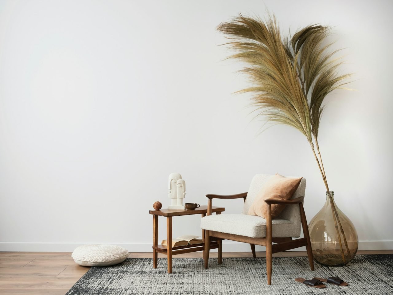 Interior design of aesthetic and minimalist living room with boucle armchair, wooden coffee table