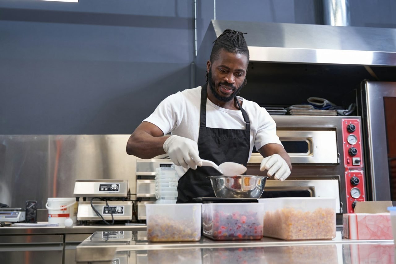 American chef preparing ingredients for baking at the kitchen