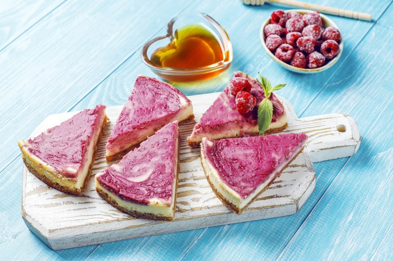 Homemade raspberry cheesecake with honey.