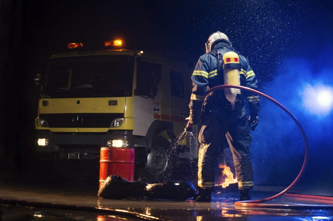 Muscular firefighter on mission