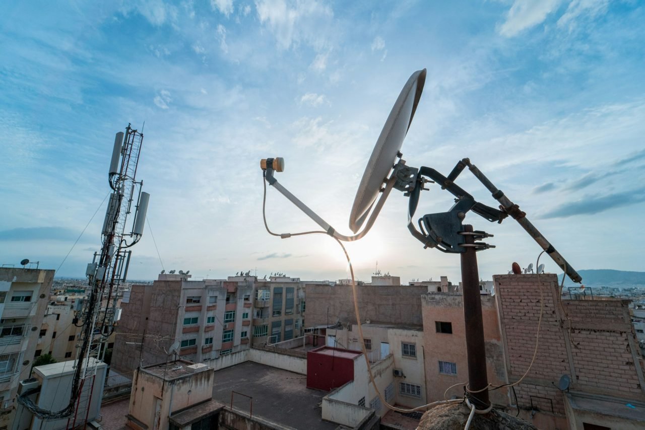 TV satellite dish with sunset sky in the background