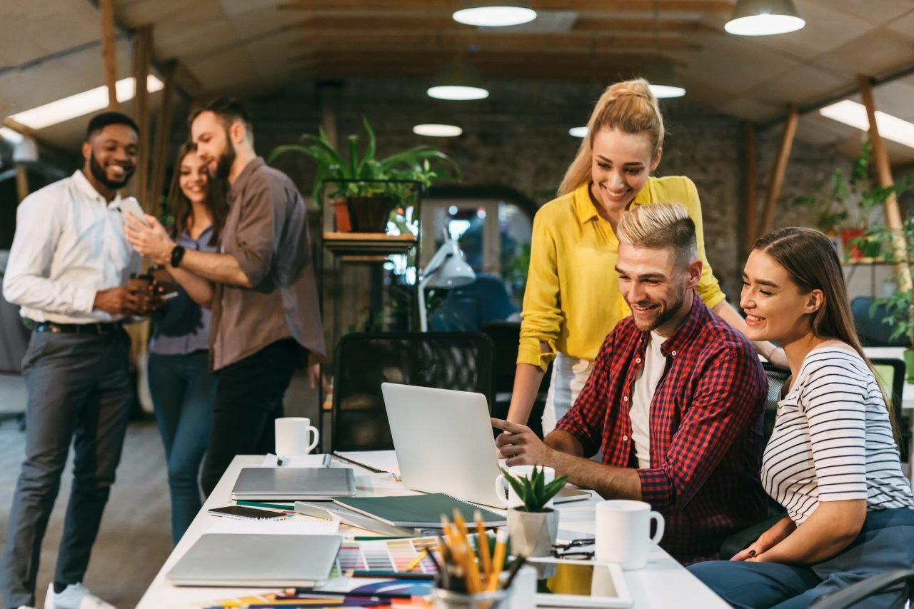 Young web designers working together at modern office
