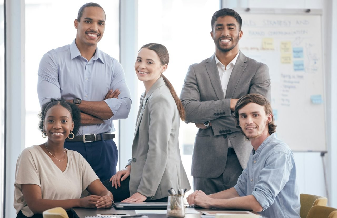 Were a happy team. Shot of a group of businesspeople at work.