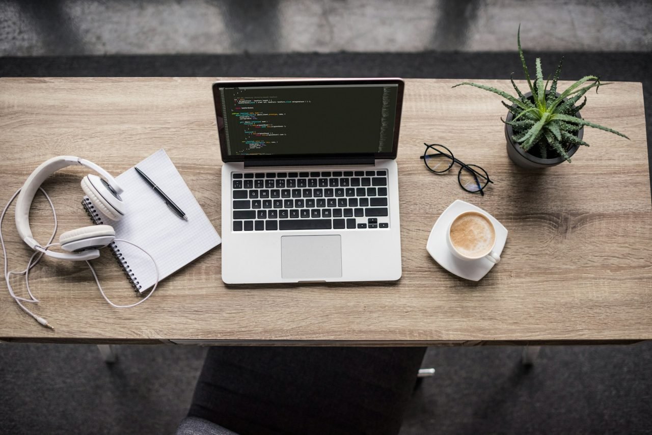 top view of programmer laptop on modern workplace
